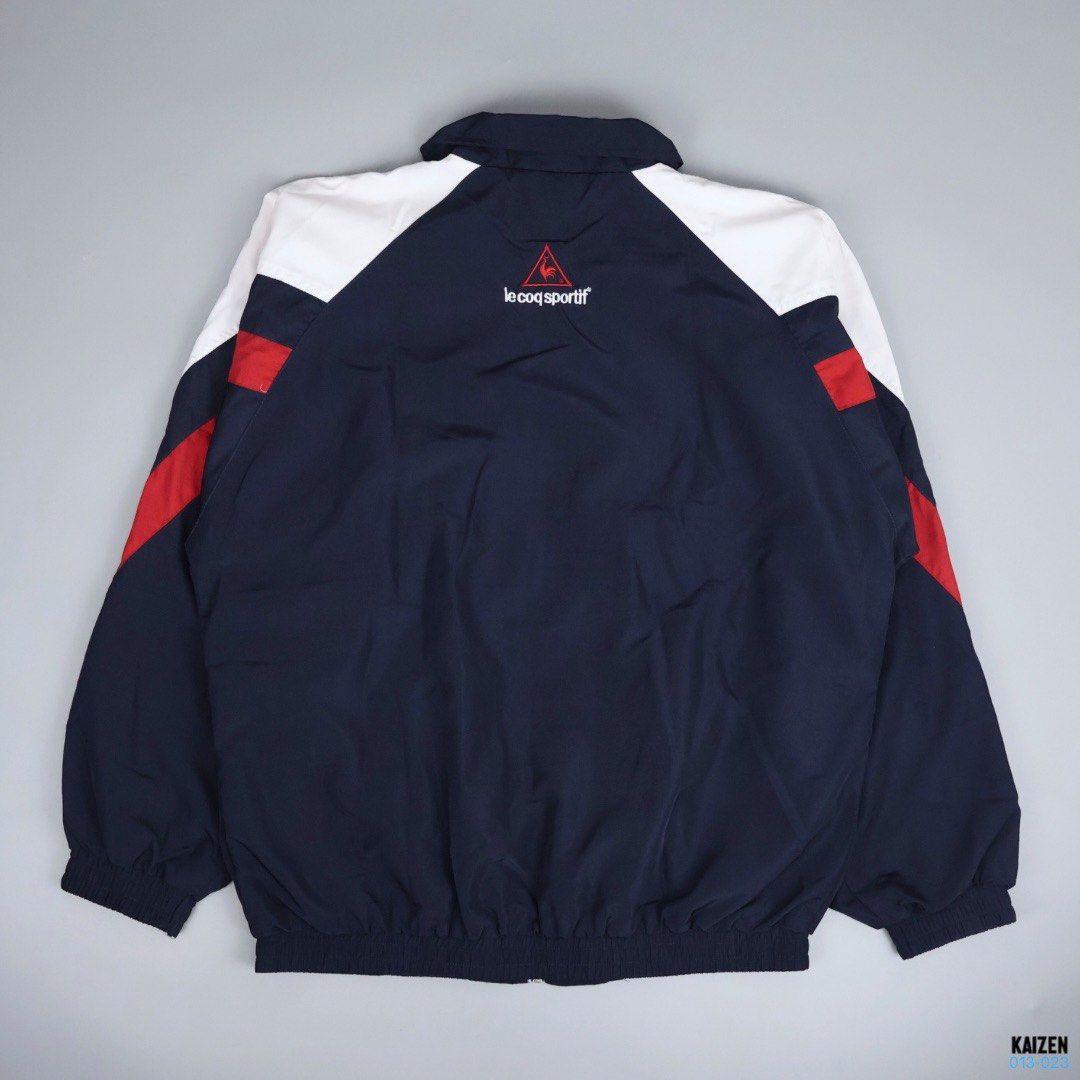 LECOQ SPORTIF SIDE TAPE TRACK JACKET (Category: Coats, Jackets and Outerwear) located in Obando. Submitted by _kaizen2022 (Listing ID 1314479997, Image 2). Description: LECOQ SPORTIF SIDE TAPE TRACK JACKET - Size: L on tag Dimensions: Length - 26.5” Width - 24” SL - 19” S to S - 23” Color: White/Navy Blue/Red Condition: Excellent Condition, good as new (10/10) 🏷️ : ₱ 990 + sf - ☑ Legit/Authentic ☑ Actual photos posted No cancellation of order/s.