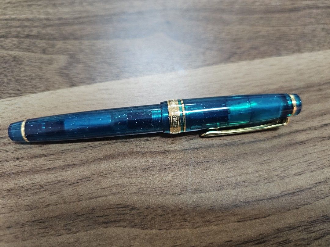 Limited Ed Sailor PGS Blue Green Nebula (Category: Stationery & School Supplies) located in Pasig City. Submitted by sibsmnl (Listing ID 1314133200, Image 2). Description: Sailor Pro Gear Slim - Blue Green Nebula. This pen is part of Sailor's Universe series, limited 2021 edition. 14K EF Gold Nib Fill Mechanism: Cartridge/Converter (Sailor proprietary) Comes with a converter Blue Green Nebula is a 2021 worldwide release with 1800 limited producti