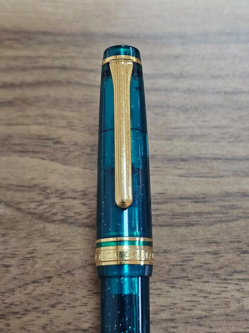 Limited Ed Sailor PGS Blue Green Nebula (Category: Stationery & School Supplies) located in Pasig City. Submitted by sibsmnl (Listing ID 1314133200, Image 1). Description: Sailor Pro Gear Slim - Blue Green Nebula. This pen is part of Sailor's Universe series, limited 2021 edition. 14K EF Gold Nib Fill Mechanism: Cartridge/Converter (Sailor proprietary) Comes with a converter Blue Green Nebula is a 2021 worldwide release with 1800 limited producti