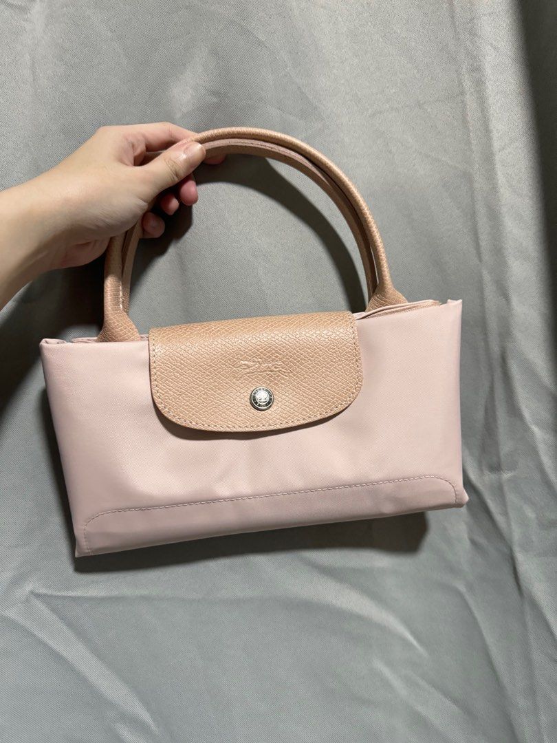 Longchamp Le Pliage Green (Pink) - Medium Short Handle (Category: Luxury Bags & Wallets) located in Manila. Submitted by maria.lao (Listing ID 1314430927, Image 3). Description: Longchamp Le Pliage Green - Pink - Medium short handle - Used only once, comes with box (Rustan’s).
