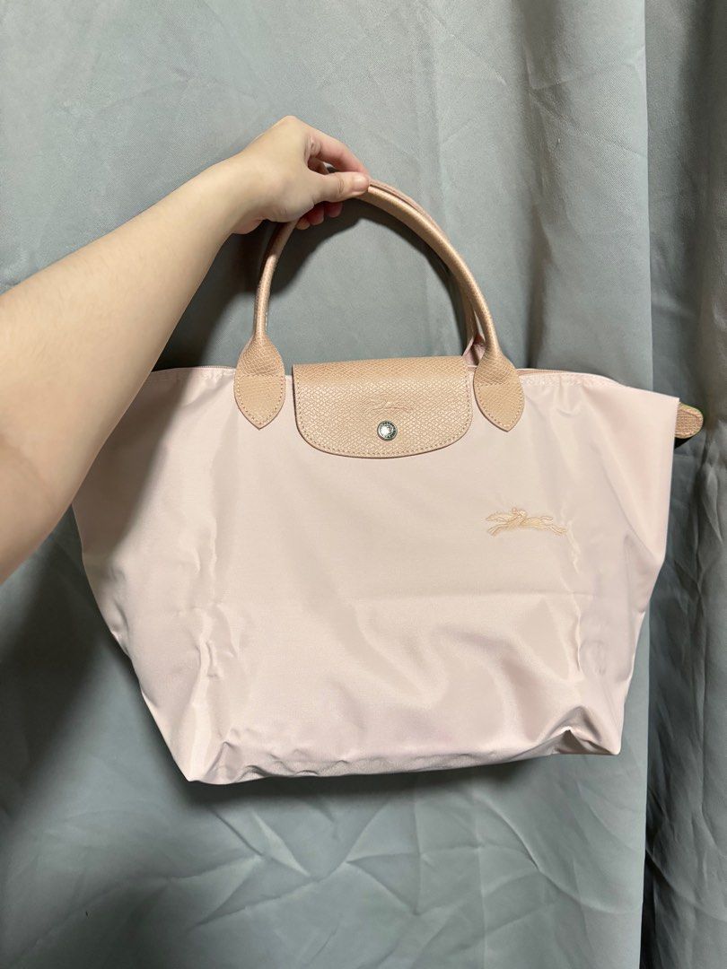 Longchamp Le Pliage Green (Pink) - Medium Short Handle (Category: Luxury Bags & Wallets) located in Manila. Submitted by maria.lao (Listing ID 1314430927, Image 2). Description: Longchamp Le Pliage Green - Pink - Medium short handle - Used only once, comes with box (Rustan’s).