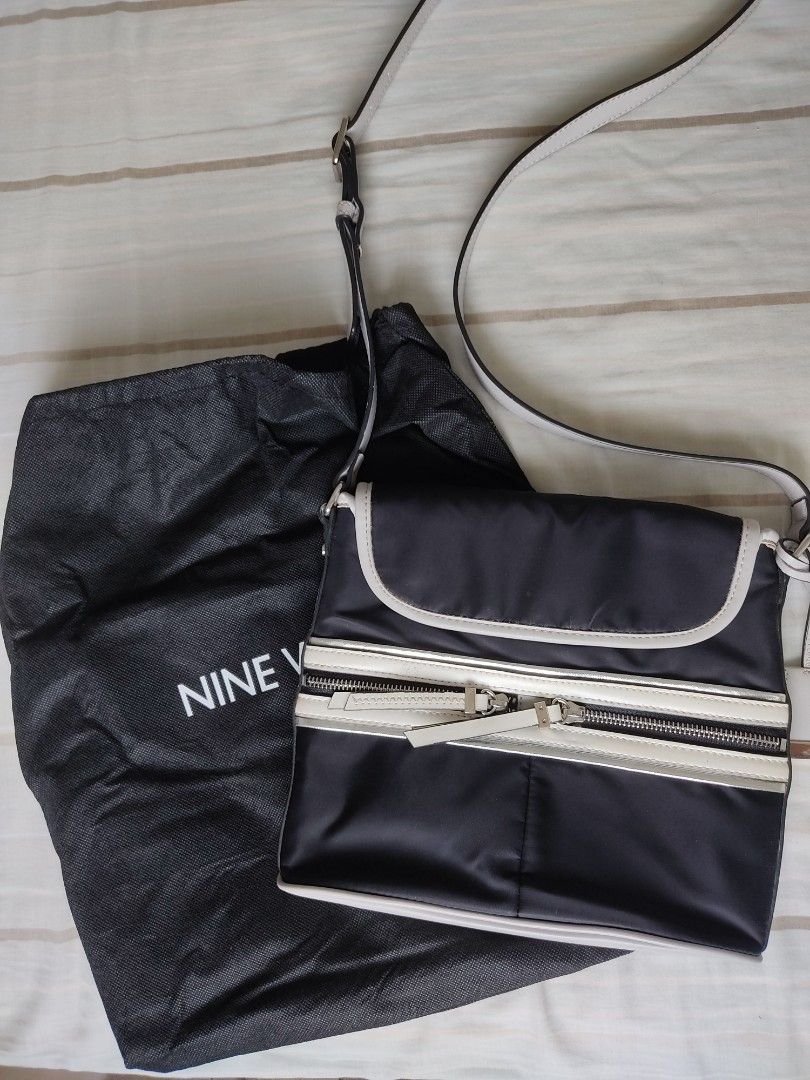 Nine West Hot Mesh (Category: Luxury Bags & Wallets) located in Carmona. Submitted by genperf (Listing ID 1314389315, Image 1). Description: Authentic Nine West Hot Mesh Messenger bag, black with white and silver edges. Lightly used, with minor scratches on leather but, hardly visible. Item is still in good condition..