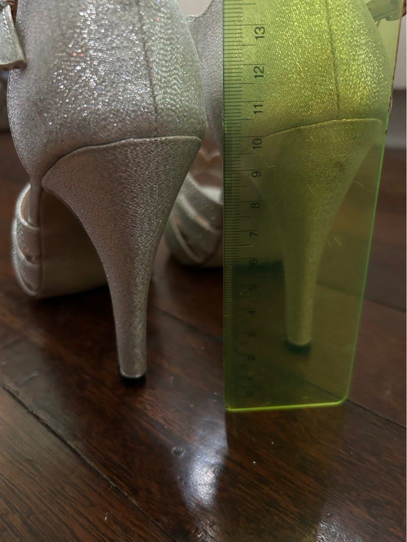 Silver high heeled shoes for formal occasions (Category: Heels) located in Malabon City. Submitted by atchnsockie (Listing ID 1314375412, Image 2). Description: Platform type Used once for a wedding Rfs: no occasion to wear See pic for height measurement No box Spare rubber heel included.
