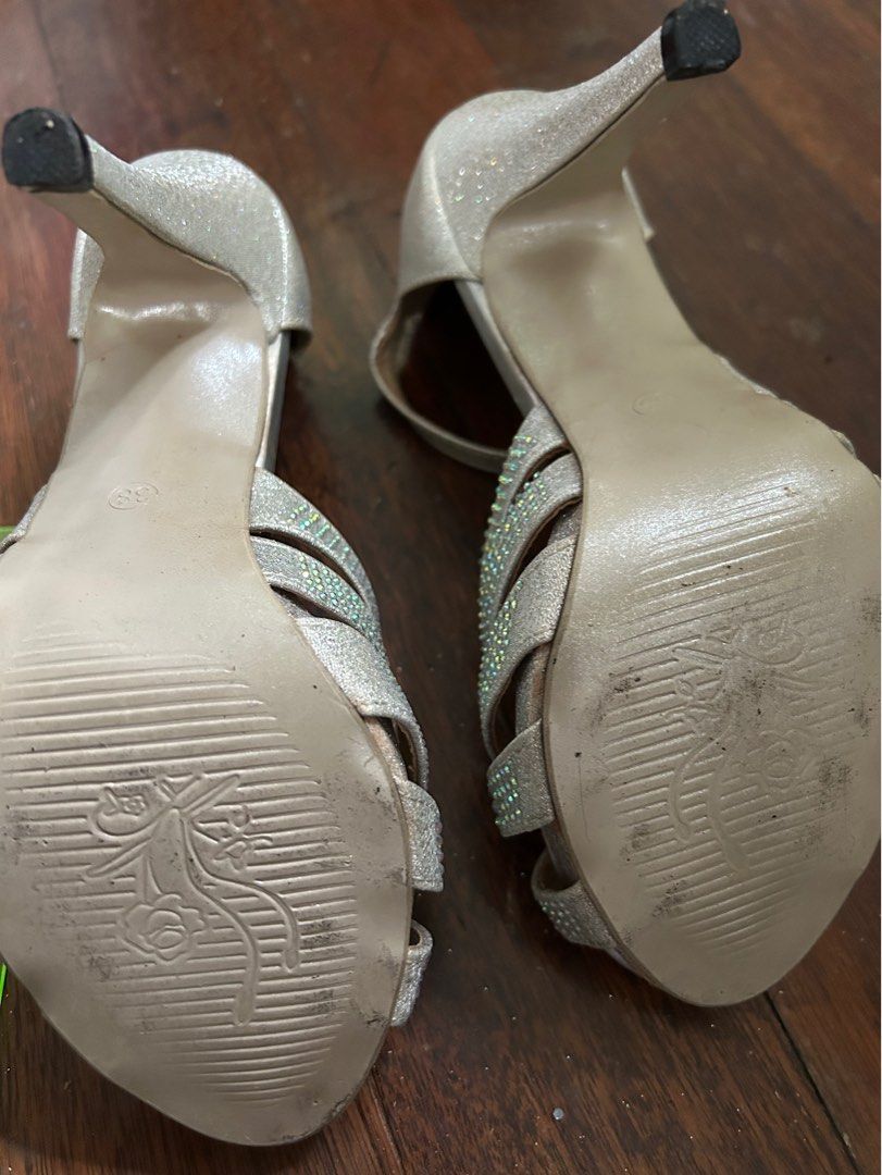 Silver high heeled shoes for formal occasions (Category: Heels) located in Malabon City. Submitted by atchnsockie (Listing ID 1314375412, Image 3). Description: Platform type Used once for a wedding Rfs: no occasion to wear See pic for height measurement No box Spare rubber heel included.