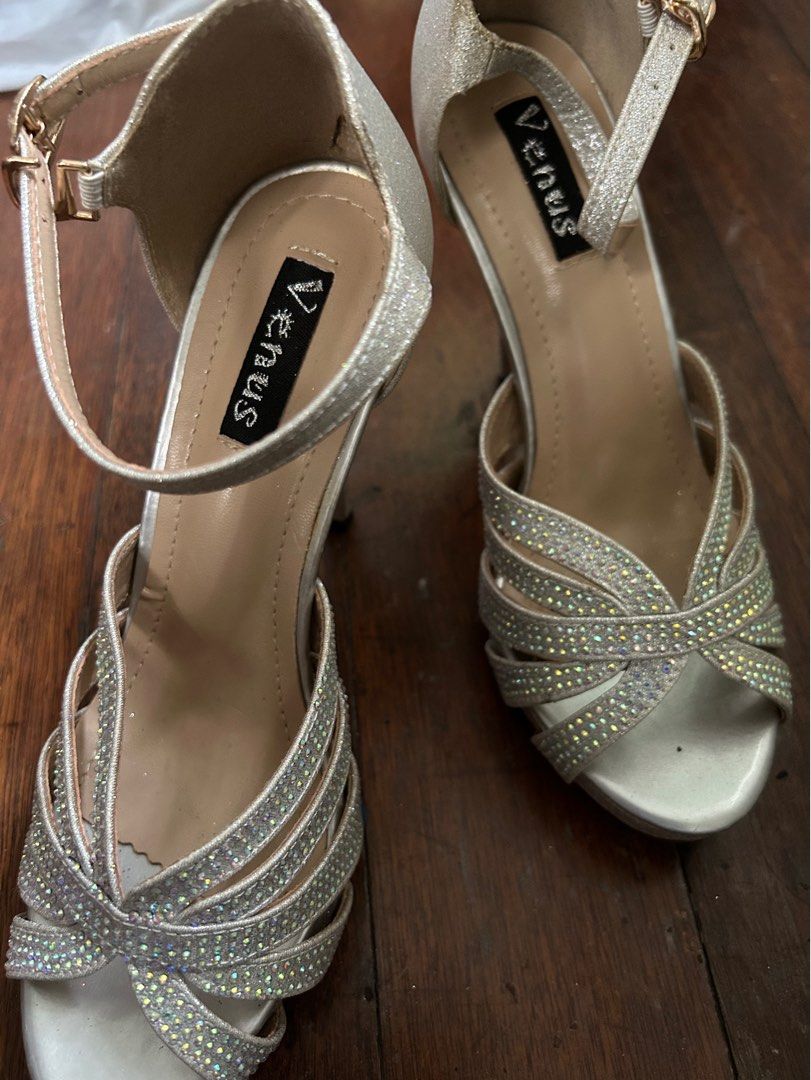 Silver high heeled shoes for formal occasions (Category: Heels) located in Malabon City. Submitted by atchnsockie (Listing ID 1314375412, Image 1). Description: Platform type Used once for a wedding Rfs: no occasion to wear See pic for height measurement No box Spare rubber heel included.
