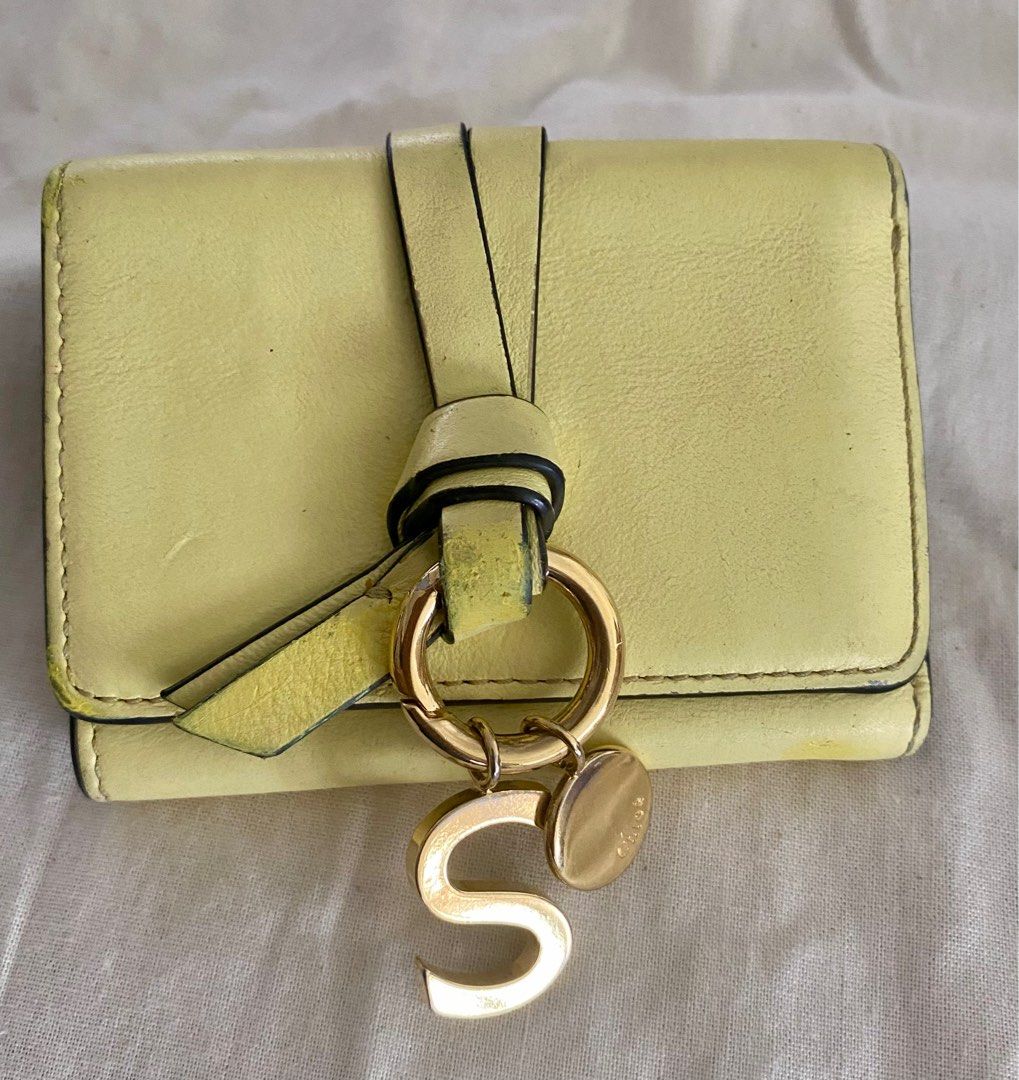 Chloe Alphabet Trifold Mini Wallet (Category: Luxury Bags & Wallets) located in Cebu City. Submitted by thedeclutteringmom (Listing ID 1314614872, Image 1). Description: Guaranteed original Moneyback if proven fake Clean inside With signs of use esp in color at the ribbon other than that the wallet is very nice Gold hardwares Soft leather (very matibay leather) 3 card slots inside bill compartment 1 coin compartment 1 bill slot Cute and nice in a
