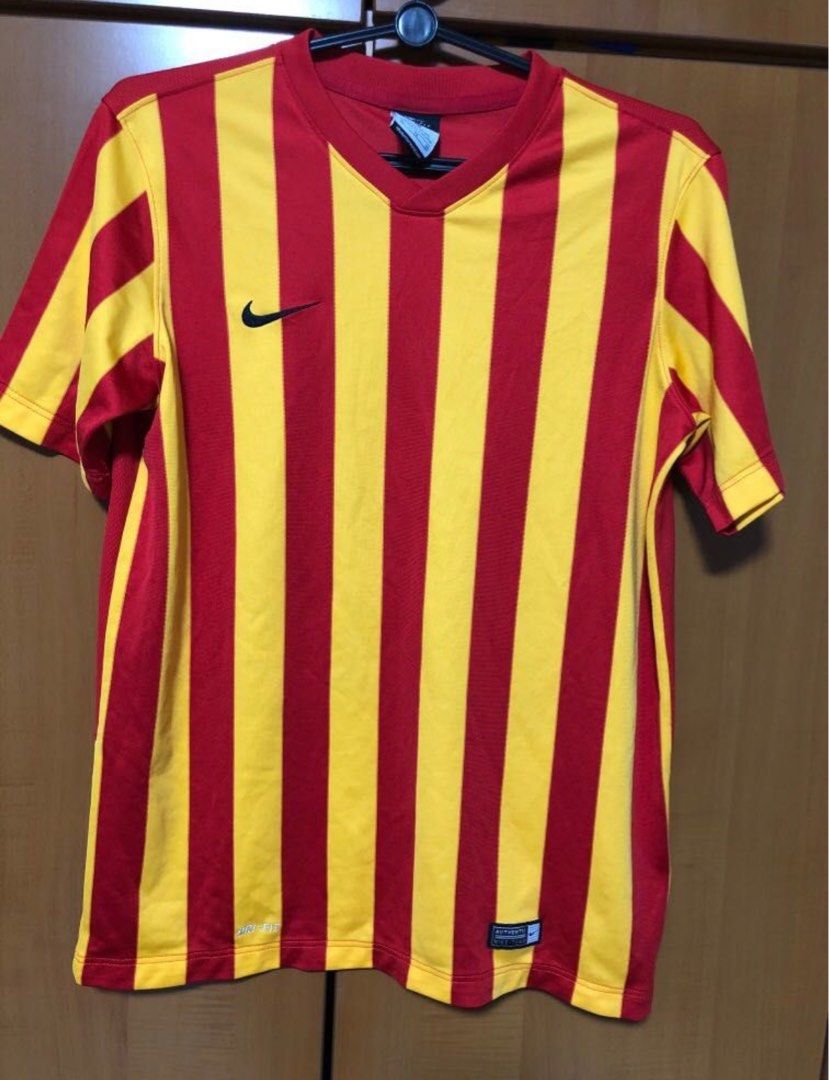 red yellow nike shirt