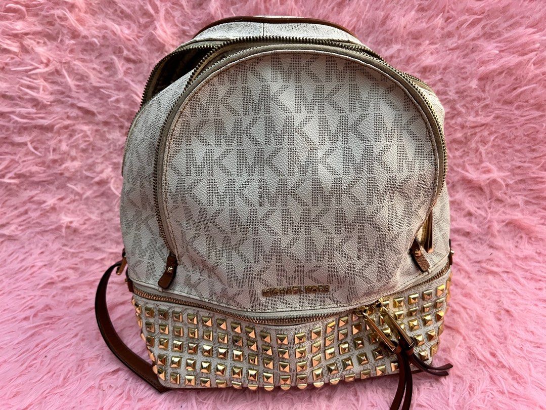 REPRICED: Original Michael Kors Backpack (Category: Luxury Bags & Wallets) located in Marilao. Submitted by sweetrepeat24 (Listing ID 1314715515, Image 1). Description: There's a bit crackings above zip main compartment due to storage, as seen on the 4th pic I already fixed it thru leather paint. But can be repairable using leather tonic cream repair gel. Hardwares are still gold. No other crackings on rubber linings. Still intact. Medyo madumi l