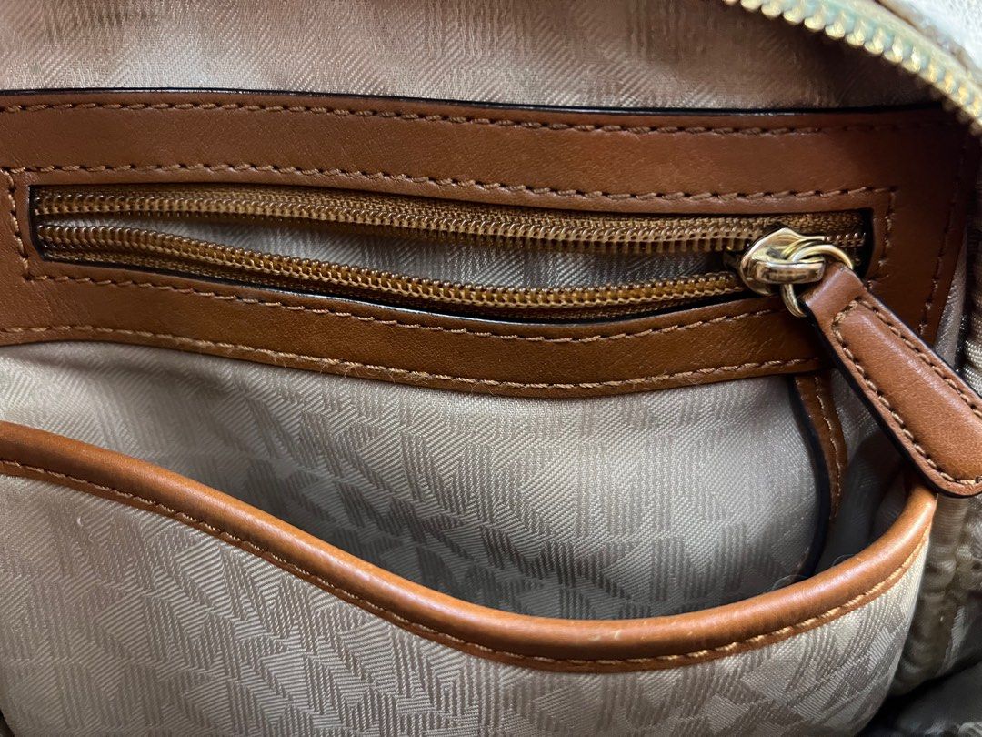 REPRICED: Original Michael Kors Backpack (Category: Luxury Bags & Wallets) located in Marilao. Submitted by sweetrepeat24 (Listing ID 1314715515, Image 3). Description: There's a bit crackings above zip main compartment due to storage, as seen on the 4th pic I already fixed it thru leather paint. But can be repairable using leather tonic cream repair gel. Hardwares are still gold. No other crackings on rubber linings. Still intact. Medyo madumi l