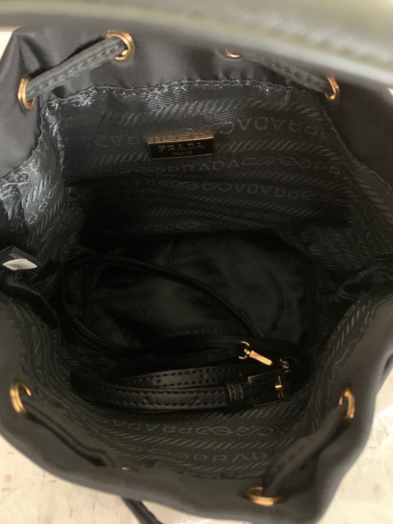 Prada nylon bucket (Category: Luxury Bags & Wallets) located in Calamba. Submitted by mineyourscollection (Listing ID 1314634881, Image 3). Description: Sourced from Japan Gold hardware Lampo zip Double tag Laminated plate logo Used once .