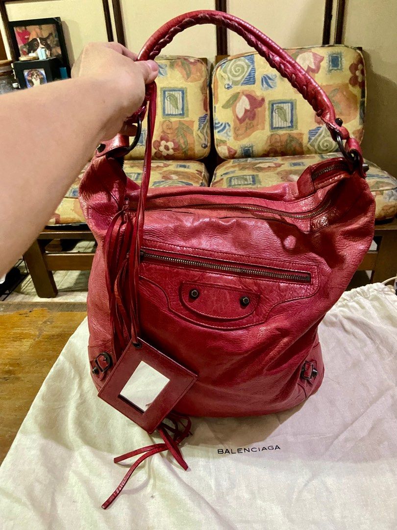 Balenciaga Day Hobo Bag (Category: Luxury Bags & Wallets) located in Manila. Submitted by rosamanerds (Listing ID 1314831925, Image 2). Description: Authentic Preloved Balenciaga Day Hobo bag color red in excellent condition. No issue Normal signs of use only. Made in Italy. With dust bag and cards. No to low ballers pls!!!.