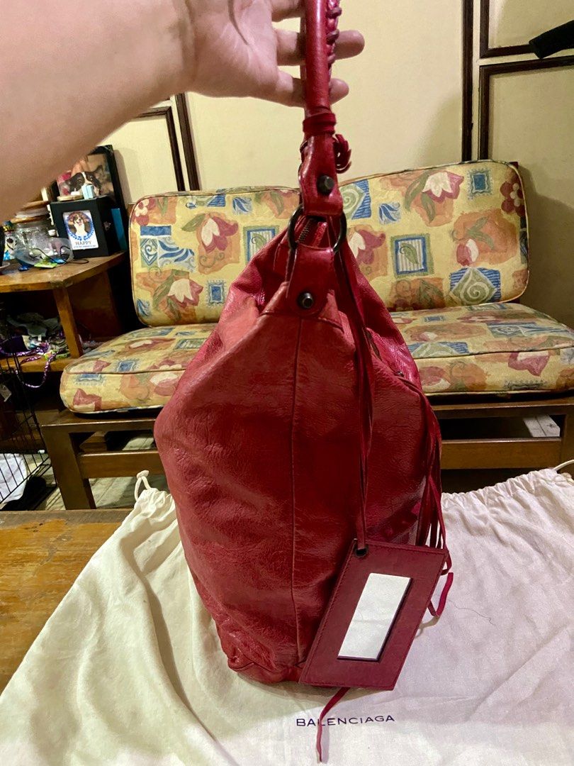 Balenciaga Day Hobo Bag (Category: Luxury Bags & Wallets) located in Manila. Submitted by rosamanerds (Listing ID 1314831925, Image 3). Description: Authentic Preloved Balenciaga Day Hobo bag color red in excellent condition. No issue Normal signs of use only. Made in Italy. With dust bag and cards. No to low ballers pls!!!.