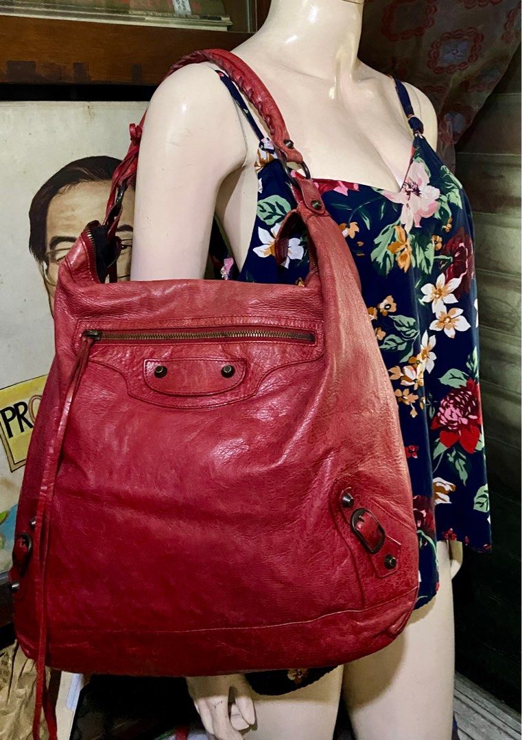 Balenciaga Day Hobo Bag (Category: Luxury Bags & Wallets) located in Manila. Submitted by rosamanerds (Listing ID 1314831925, Image 1). Description: Authentic Preloved Balenciaga Day Hobo bag color red in excellent condition. No issue Normal signs of use only. Made in Italy. With dust bag and cards. No to low ballers pls!!!.