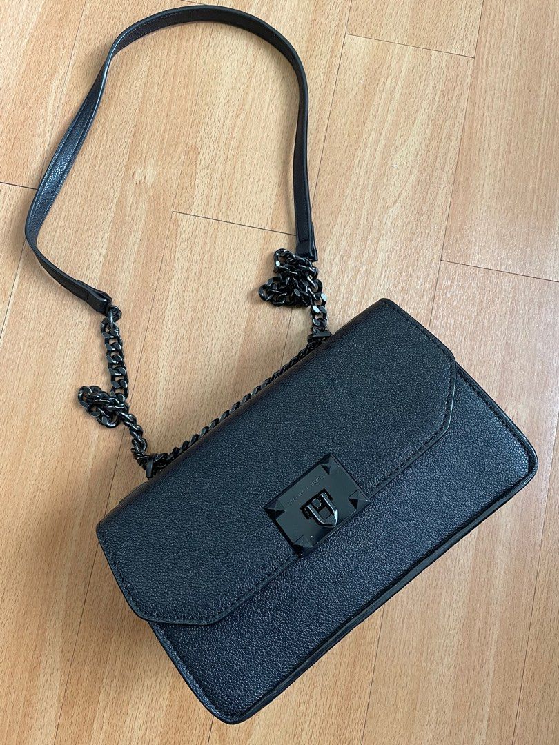 Charles & Keith Matte Black Push-Lock Crossbody Bag (Category: Cross-body Bags) located in Marilao. Submitted by aint_b23 (Listing ID 1314935803, Image 1). Description: Charles & Keith Matte Black Push-Lock Crossbody Bag flaws: leather rubs on the side, scratched hardware sling sf to be shouldered by the buyer.
