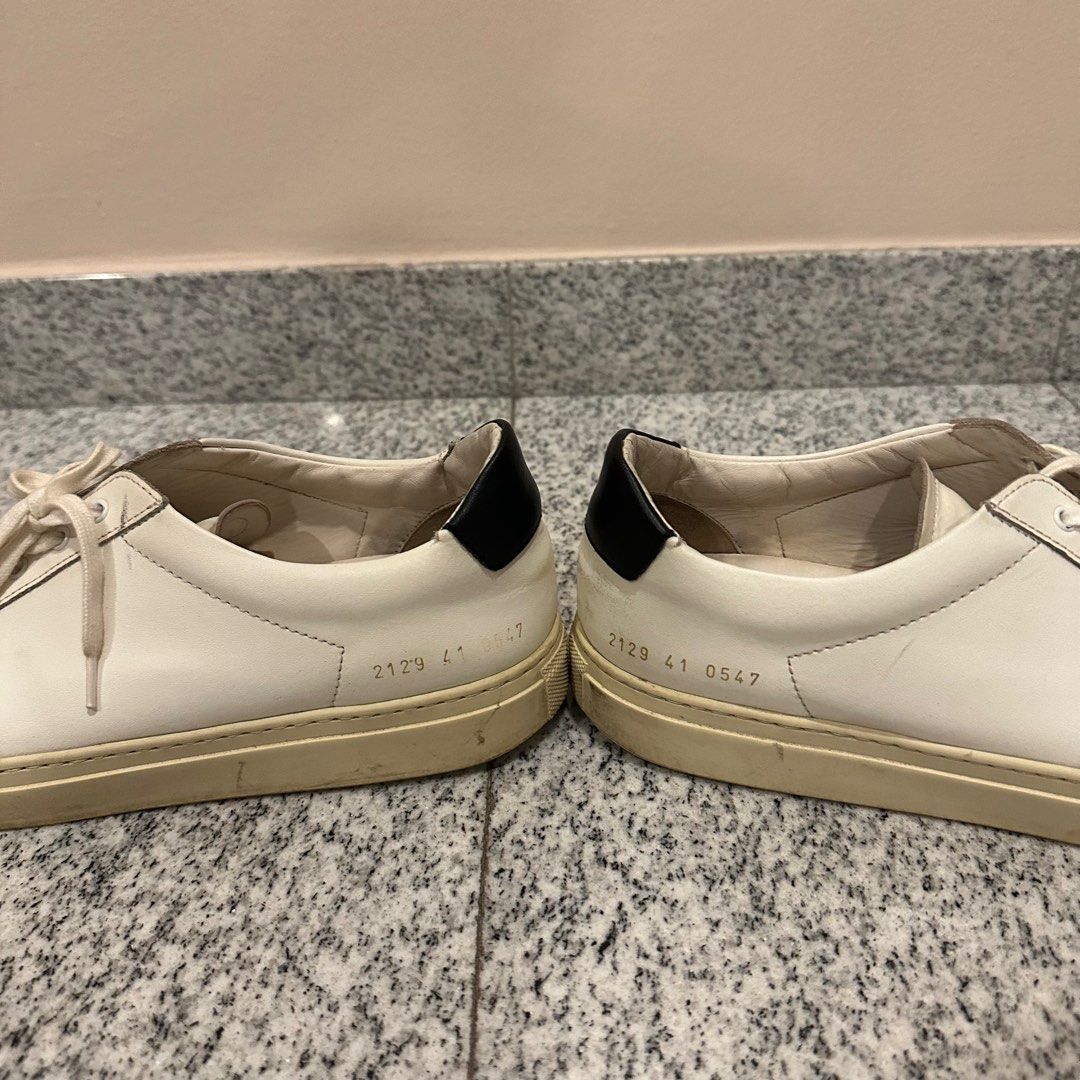 Common project (Category: Sneakers & Footwear) located in Singapore. Submitted by foxay (Listing ID 1314864591, Image 3). Description: Condition as shown in pictures Slight tear at the back of the shoes Wording on left side has faded .