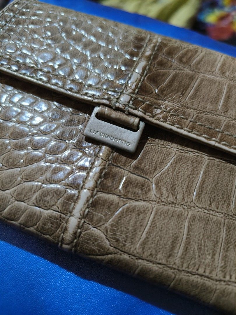 Liz Claiborne Croc Embossed Tri-Fold Wallet (Category: Luxury Bags & Wallets) located in Cabuyao City. Submitted by cookietherapyph (Listing ID 1314929773, Image 1). Description: No major flaws, still functions as it should Issues: Stains inside and the coin compartment zipper (can still close zipper, just needs something attached to it to easily open/close) RFS: Decluttering MOP: Gcash SHIPPING: J&T or Gogoxpress.