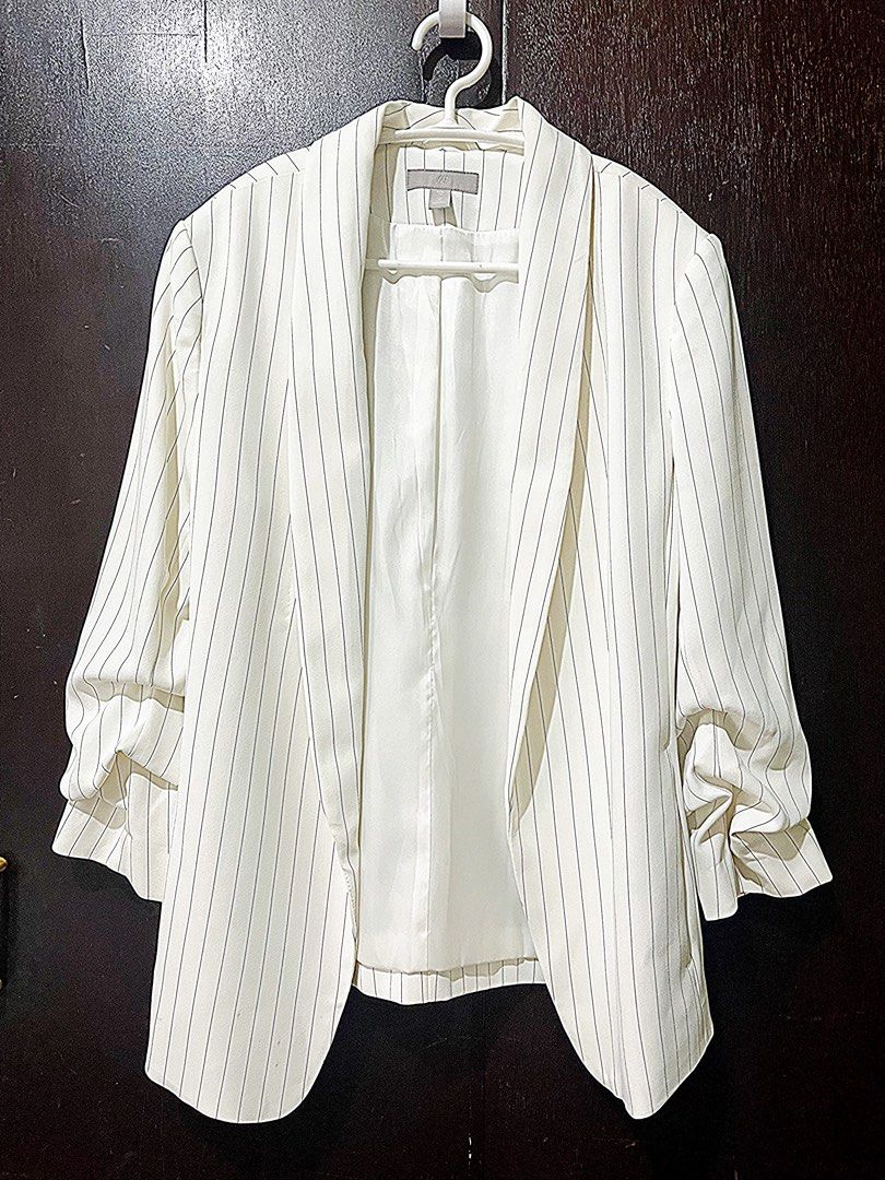 H&M Formal Ruffle Blazer Pinstripe White (Category: Others Tops) located in Manila. Submitted by kcstuffetc (Listing ID 1314969044, Image 1). Description: H&M Formal Ruffle Blazer Pinstripe White Used once. No signs of wear. *Earlier listed with stains but it was already handwashed. Shoulder 16” Bust 36” Length 35” RFS: closet overhaul Payment through GCash, BPI or BDO .
