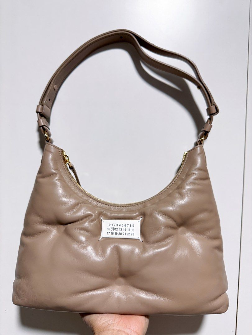 Maison Margiela Glam Slam Hobo Bag (Category: Bags & Wallets) located in Singapore. Submitted by slightlycloser (Listing ID 1315018451, Image 1). Description: Retailing at 2905, one minor back corner rub otherwise like new. :) Comes with receipt and paper bag Straps can be extended be to be a crossbody bag as well. Very roomy hobo bag. .
