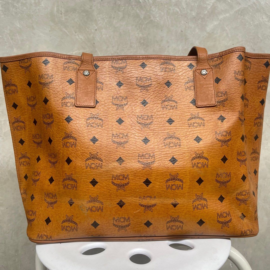 MCM Cognac Tote Bag (Category: Luxury Bags & Wallets) located in Quezon City. Submitted by akg07 (Listing ID 1314998106, Image 2). Description: Visetos Crocodile Embossed Medium Liz Shopper Tote Cognac Well used mcm tote bag With minimal signs of use Signs of wear sa leather at the back Silver hardwares .