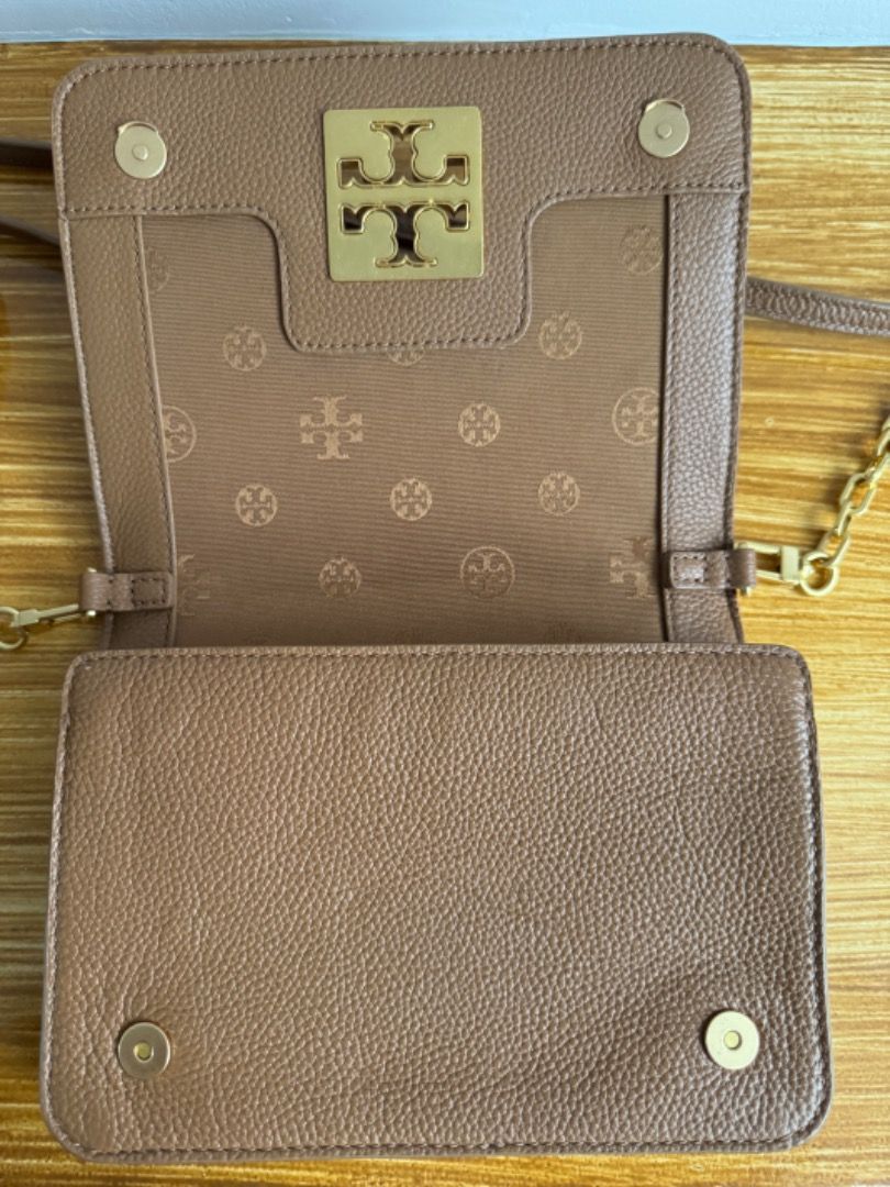 Tory Burch Britten Crossbody Bag (Category: Luxury Bags & Wallets) located in Carmona. Submitted by raest16 (Listing ID 1315043094, Image 2). Description: Like New. Used only once. Authentic bought in US. Color: Brown Gold Hardware Strap removable and adjustable MOP: BDO, Gcash MOD: LBC, Lalamove c/o Buyer Location: Carmona Cavite.