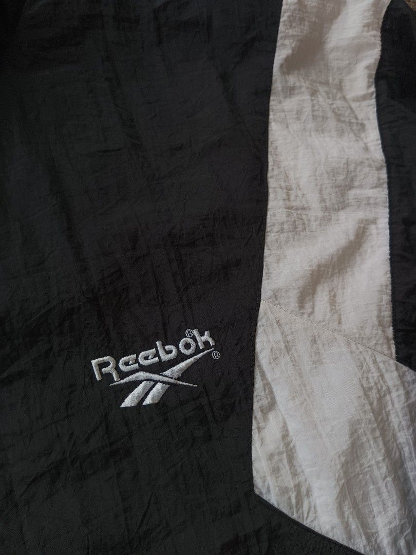 Vintage Reebok Windbreaker Jacket (Category: Coats, Jackets and Outerwear) located in Dagupan City. Submitted by plugofallthreads (Listing ID 1315010390, Image 3). Description: Vintage Reebok Windbreaker Size: L/XL Oversize Length: 28 inches Width: 27 inches Authentic vintage piece from the 90s. No hole. No run. Working zippers and garters. Faint unnoticeable stain on white part. Will send photos. Price: Php 1,500 plus sf DM TO PURCHASE.