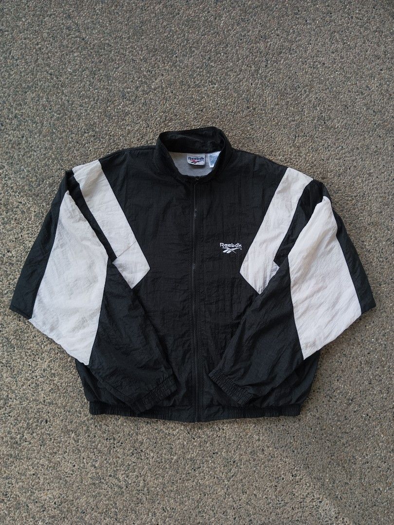 Vintage Reebok Windbreaker Jacket (Category: Coats, Jackets and Outerwear) located in Dagupan City. Submitted by plugofallthreads (Listing ID 1315010390, Image 2). Description: Vintage Reebok Windbreaker Size: L/XL Oversize Length: 28 inches Width: 27 inches Authentic vintage piece from the 90s. No hole. No run. Working zippers and garters. Faint unnoticeable stain on white part. Will send photos. Price: Php 1,500 plus sf DM TO PURCHASE.