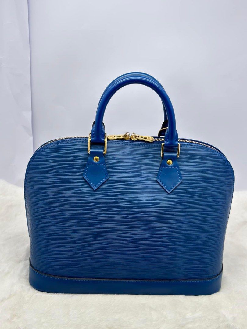 Authentic Louis Vuitton (Category: Luxury Bags & Wallets) located in Manila. Submitted by chloe_luxuries (Listing ID 1315272194, Image 2). Description: Guaranteed original Louis Vuitton Alma epi Still in very good condition No More inclusion bag only Pm for more details.