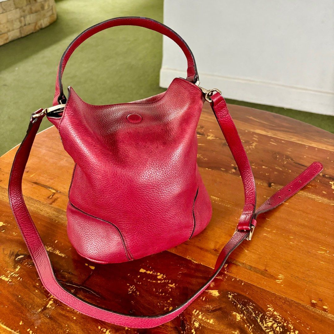 Massimo Dutti two-way bucket bag in maroon (Category: Cross-body Bags) located in Pasig City. Submitted by lexans_bentables (Listing ID 1315221698, Image 1). Description: Authentic Massimo Dutti two-way bucket bag in maroon ❣️ CLEARANCE SALE ❣️ - made of soft and slouchy real leather - made in Spain - magnetic closure - can be used as handbag or crossbody bag - clean suede lining, no foul smell - hardware still shiny - no rubs, no cracks, no peel