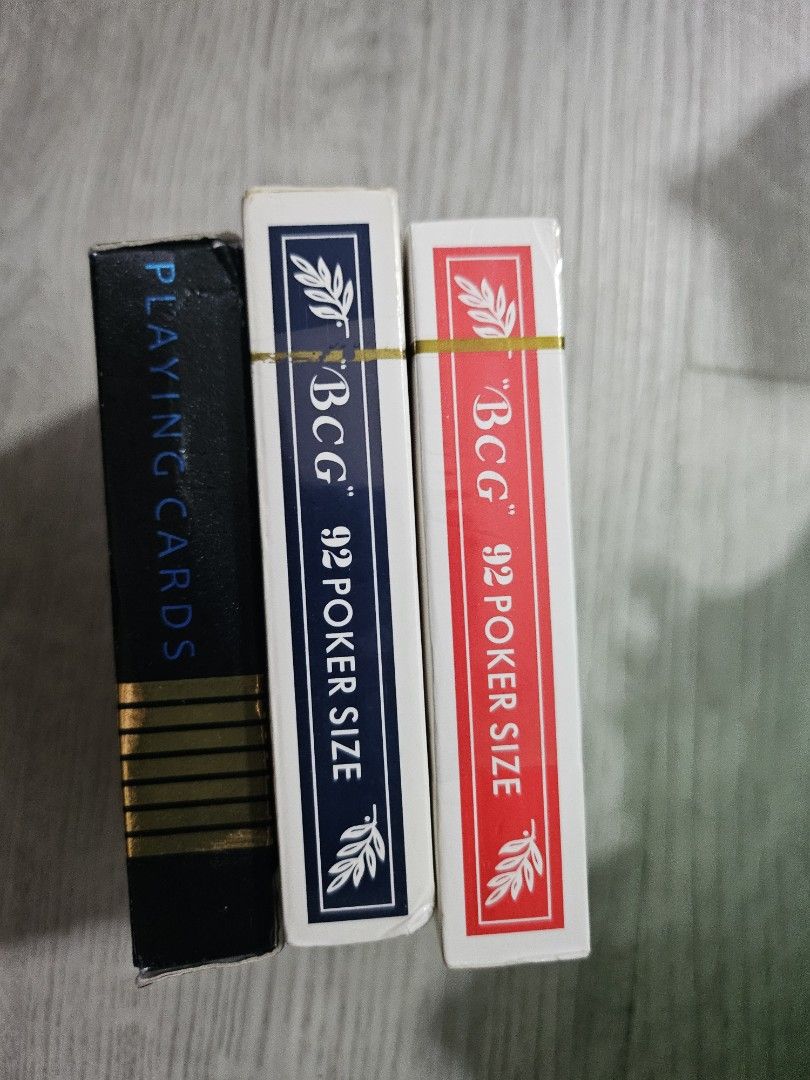 Playing cards (Category: Board Games & Puzzles) located in Singapore. Submitted by ching_0513 (Listing ID 1315190607, Image 3). Description: red box- 5$ new, not opened yet blue box- 4$ black box - 3$ take all -10$.