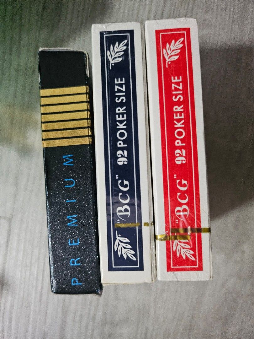 Playing cards (Category: Board Games & Puzzles) located in Singapore. Submitted by ching_0513 (Listing ID 1315190607, Image 2). Description: red box- 5$ new, not opened yet blue box- 4$ black box - 3$ take all -10$.