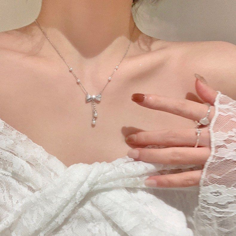 PRE ORDER Korean Fashion Pearl Rhinestone Butterfly Niche Design Simple Classy Necklace Ribbon Necklace Women s Fashion Jewelry Organisers Necklaces on Carousell