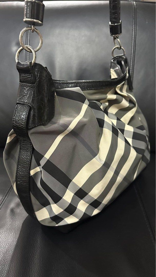 Authentic Burberry (Category: Luxury Bags & Wallets) located in Manila. Submitted by chloe_luxuries (Listing ID 1312035296, Image 2). Description: Guaranteed original Burberry Nova Check hobo bag Still in very good condition Comes with dustbag Pm for more details .