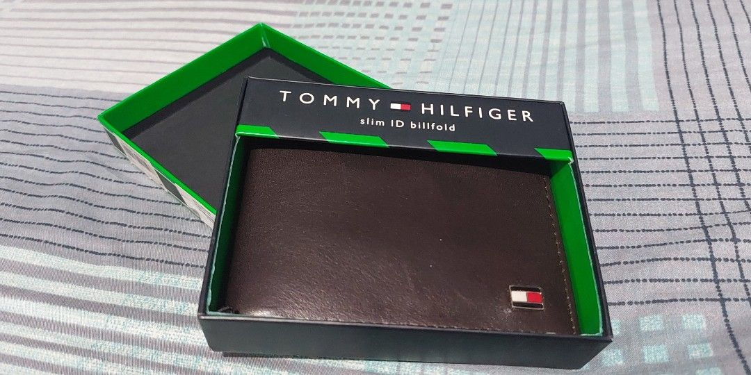 Authentic Tommy Hilfiger Wallet NEW IN BOX (Category: Wallets & Card Holders) located in Manila. Submitted by time07 (Listing ID 1311977807, Image 1). Description: Tommy Hilfiger Men's Leather Wallet / Billfold --Security strap still attached. --Premium Leather Bi-fold Wallet --This is a brand new bi-fold wallet, spacious enough to hold all your cards and cash. --Great gift for men. Brand: Tommy Hilfiger Style: Billfold Color: Dark Brown Material