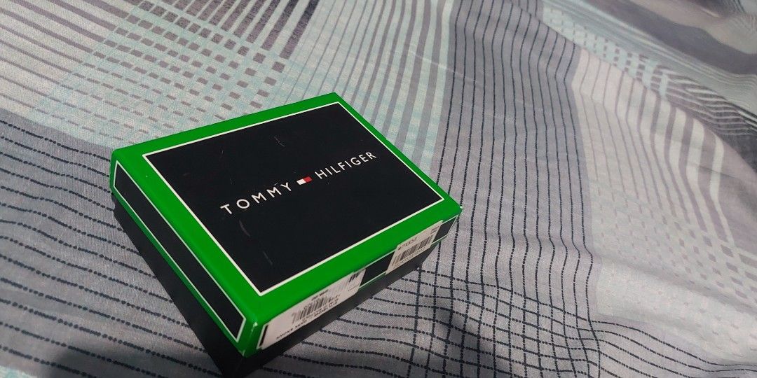 Authentic Tommy Hilfiger Wallet NEW IN BOX (Category: Wallets & Card Holders) located in Manila. Submitted by time07 (Listing ID 1311977807, Image 3). Description: Tommy Hilfiger Men's Leather Wallet / Billfold --Security strap still attached. --Premium Leather Bi-fold Wallet --This is a brand new bi-fold wallet, spacious enough to hold all your cards and cash. --Great gift for men. Brand: Tommy Hilfiger Style: Billfold Color: Dark Brown Material