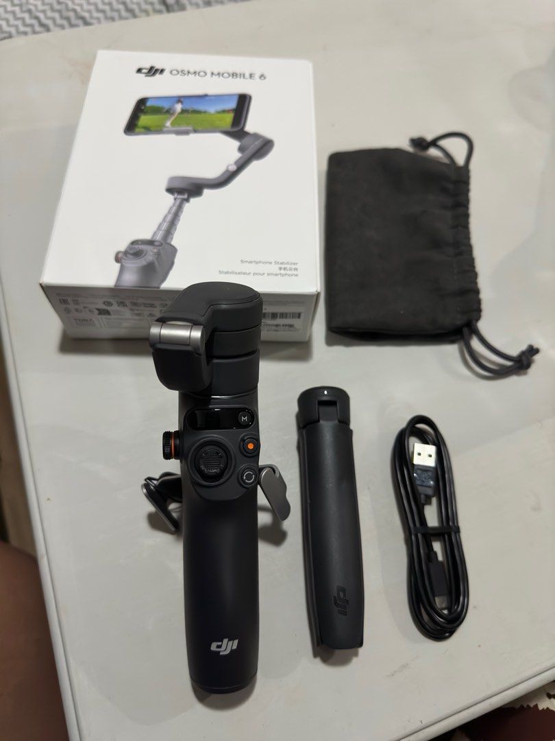 DJI osmo mobile 6 - Complete used only once (Category: Cameras) located in Makati City. Submitted by declutter_master (Listing ID 1311922258, Image 3). Description: used only once for our Hongkong trip. like new. Original price is 7995 for the mall Conplete Package .