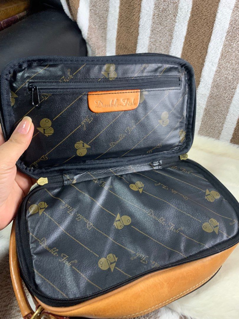 Double fish milano leather clutch (Category: Luxury Bags & Wallets) located in Cabanatuan. Submitted by mjluxxejapan (Listing ID 1312079033, Image 2). Description: NO LP PLS.all details posted.like new.gandaa nto.genuine leather Approx 10”6”.kapal ng leather matibay .