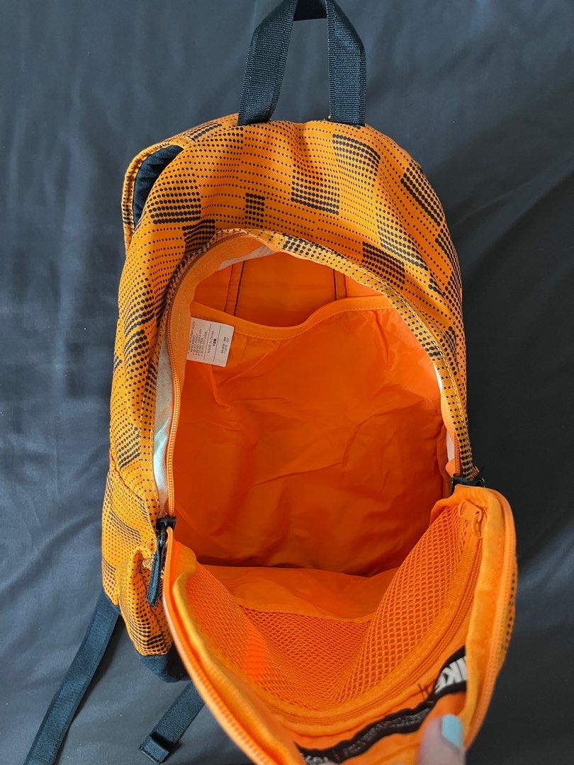 Nike Backpack (Category: Backpacks) located in Pasig City. Submitted by beldc (Listing ID 1315320249, Image 3). Description: Used Nike Backpack in color bright orange. Medium size bag (i think). Bag only. No tag or paper bag. With signs of usage but still in good condition.Please DON’T ask for dimensions and specifics of bag as i am also not sure. Please DON’T ask for more photos as well as all are actual and updated photos. .