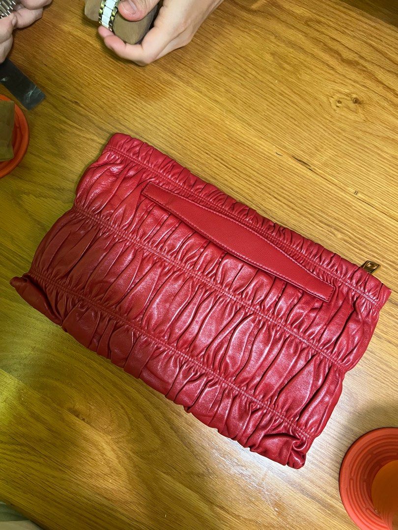 PRADA Red Nappa Gaufre Leather Clutch Bag (Category: Bags & Wallets) located in Singapore. Submitted by wilddaisy (Listing ID 1315435556, Image 2). Description: Only comes with authenticity card..
