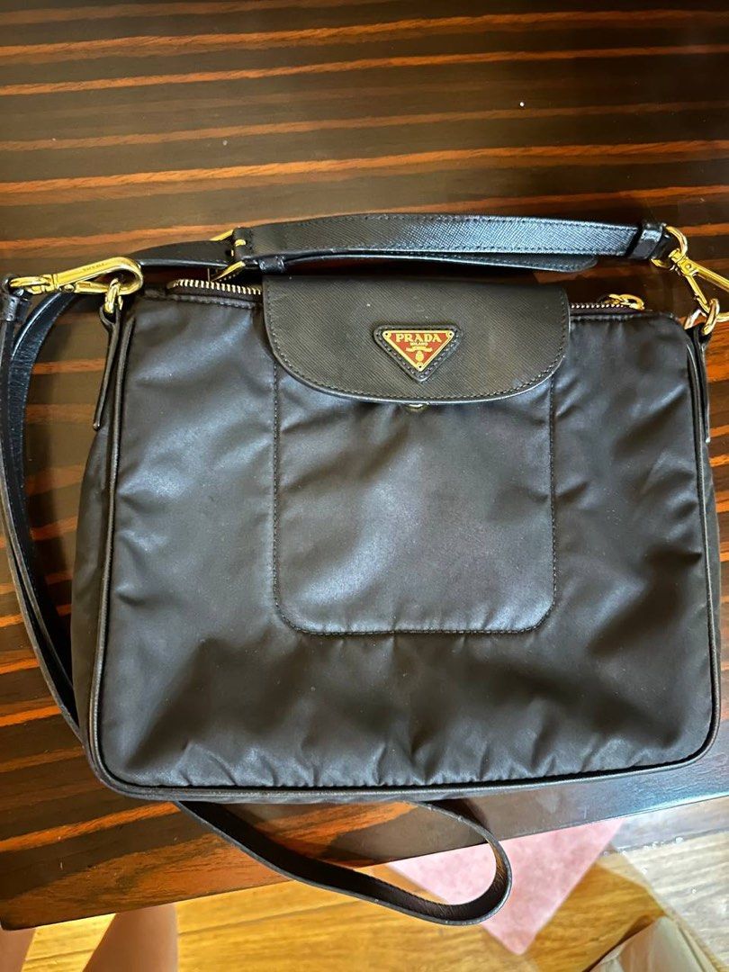 Prada tessuto nylong sling (Category: Luxury Bags & Wallets) located in Cavite. Submitted by liaamags.1 (Listing ID 1315309239, Image 1). Description: Slightly negotiable because this bag has been professionally recolored from red to black. No more flaws noticed in strap and bag. Comes with care cards and dust bag.