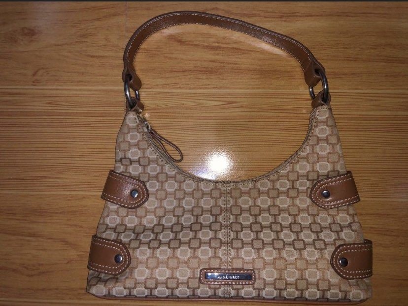 Looking for NINE WEST HOBO BAG BROWN (Category: Luxury Bags & Wallets) located in Manila. Submitted by 00000ml (Listing ID 1315524020, Image 2). Description: Looking for nine west brown bag pm me. Photo not mine.