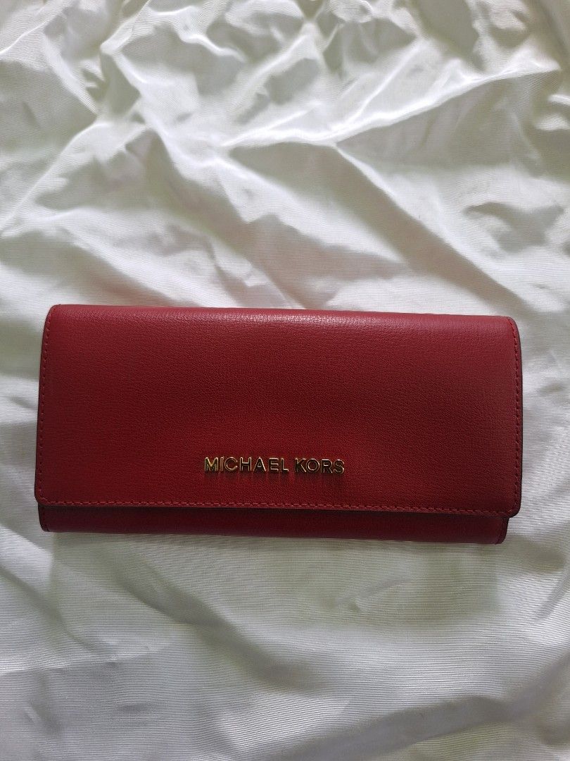 Michael Kors Jet Set Travel Wallet (Category: Wallets & Card holders) located in Quezon City. Submitted by tms.l (Listing ID 1315582378, Image 1). Description: Brandnew Intact tags and protective coverings Bought in US Color: Red Hardware: Gold.