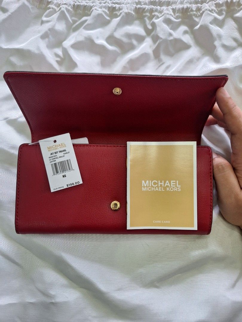 Michael Kors Jet Set Travel Wallet (Category: Wallets & Card holders) located in Quezon City. Submitted by tms.l (Listing ID 1315582378, Image 2). Description: Brandnew Intact tags and protective coverings Bought in US Color: Red Hardware: Gold.