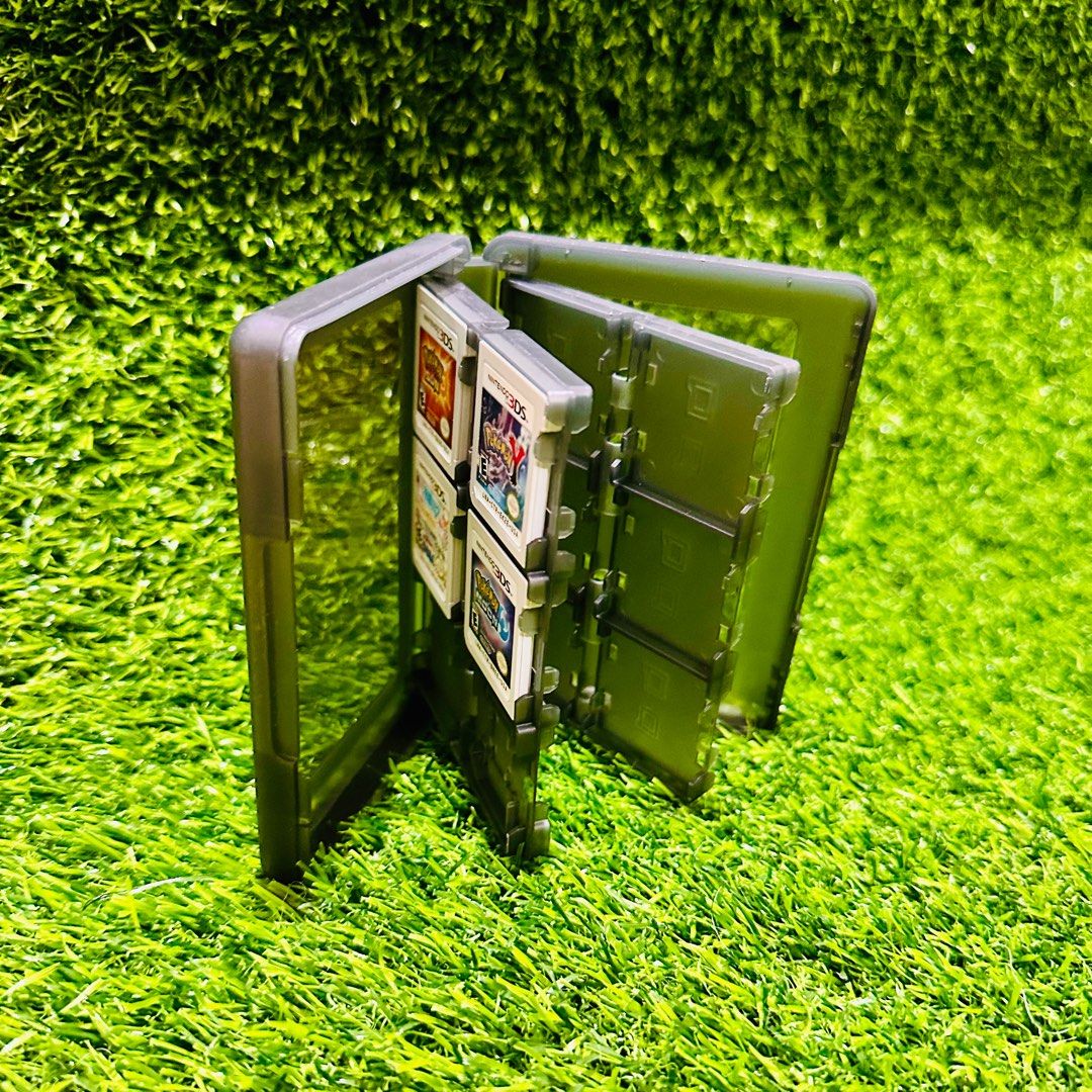 Nintendo 3DS cartridge holder (Category: Cases & Covers) located in Tagum. Submitted by zangcaesar (Listing ID 1315619949, Image 2). Description: Made of plastic Semi-transparent black/pewter Can hold 24 Nintendo 3DS cartridges Cartridges in the photos not included.