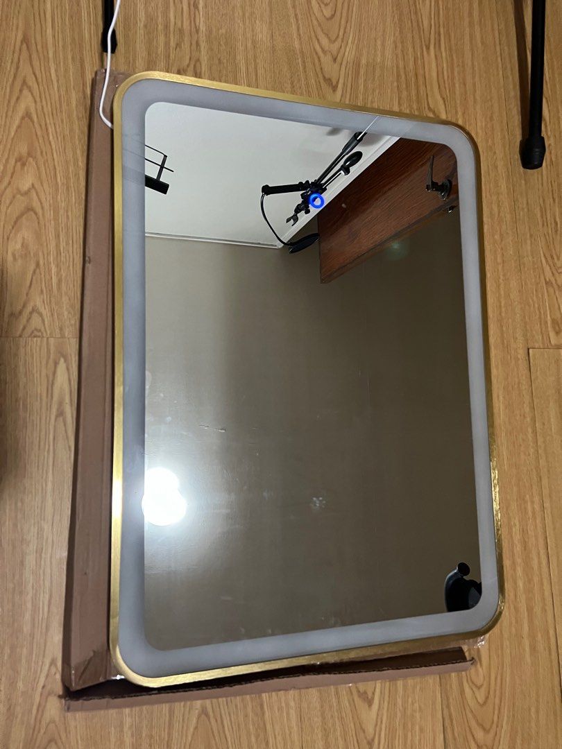 smart dimable LED mirror (Category: Makeup) located in Pasig City. Submitted by laubayag (Listing ID 1315663766, Image 2). Description: smart LED mirror with gold frame 27.5 inches height 19.5 inches width 1inch thick touch control dimmable .