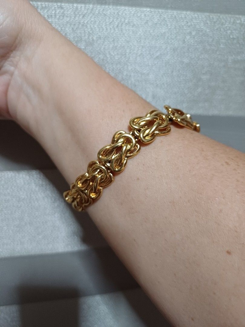 US-made Gold Tone Chunky Bracelet with Embossed Design (Category: Bracelets) located in Davao. Submitted by carriedeps (Listing ID 1315628876, Image 2). Description: An eye-catching bracelet! Non-tarnish. Never used. If you want an elegant bracelet/bangle type but soft with embossed design, this is the one! Just the right size. Can fit the regular hand size and easy wear, no need to open and close lock. Unique & classic design, solid & heavy. Sna