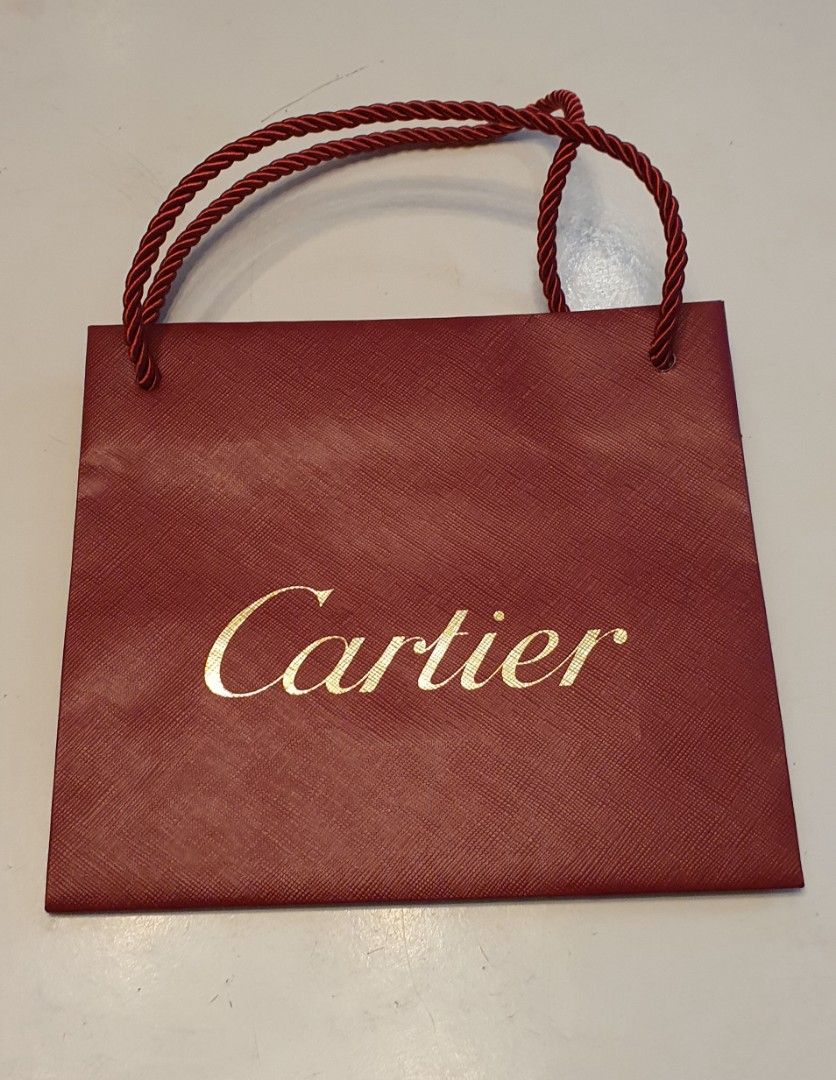 Authentic cartier paper bag (Category: Luxury Bags & Wallets) located in Cavite. Submitted by ohmie23 (Listing ID 1315830593, Image 1). Description: Authentic cartier paper bag dimentin 8x7 inch.