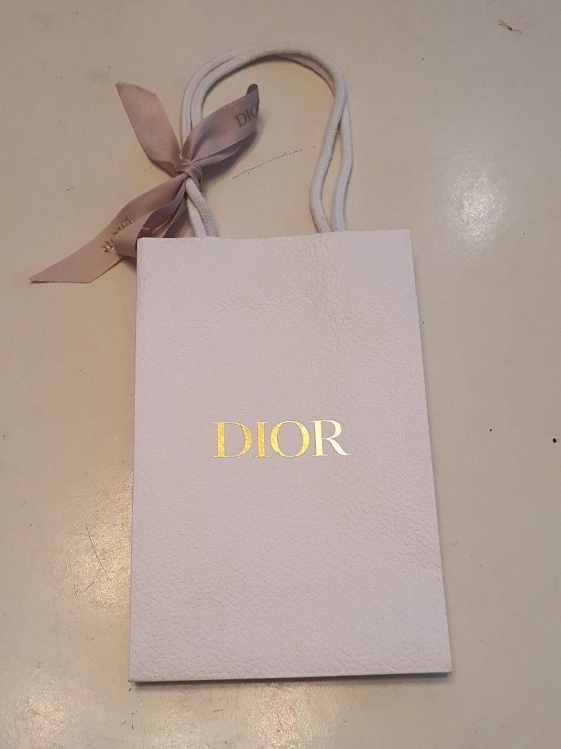 Authentic christian dior paper bag (Category: Luxury Bags & Wallets) located in Cavite. Submitted by ohmie23 (Listing ID 1315831766, Image 1). Description: Authentic christian dior paper bag dention 6x9 inch.