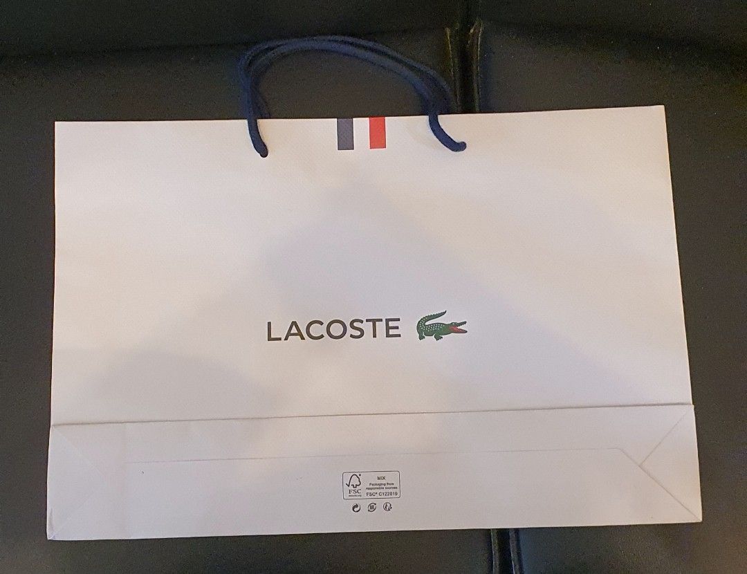 Authentic lacoste paper bag (Category: Luxury Bags & Wallets) located in Cavite. Submitted by ohmie23 (Listing ID 1315830070, Image 1). Description: Authentic lacoste paper bag dimention 12x18 inch.