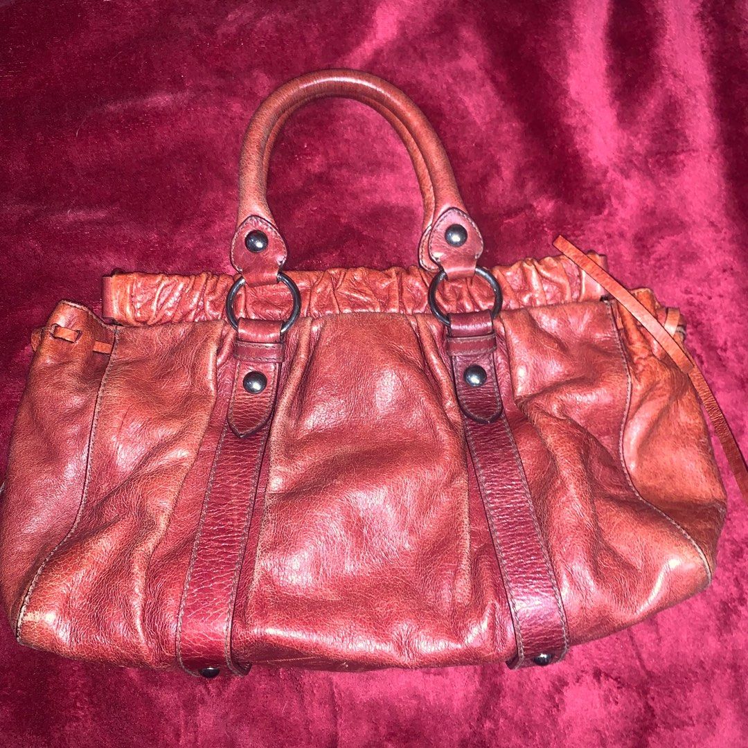 Authentic Miu Miu Vitello Lux (Category: Luxury Bags & Wallets) located in Pasig City. Submitted by dmnqarch (Listing ID 1315712768, Image 2). Description: Authentic Miu Miu Vitello Lux (medium size tote bag) It has a vintage well loved look! Normal signs of use, but no peeling/chipping of leather. No long strap, cards or original dust bag. Price is still very negotiable. Inclusions: replacement dust bag.