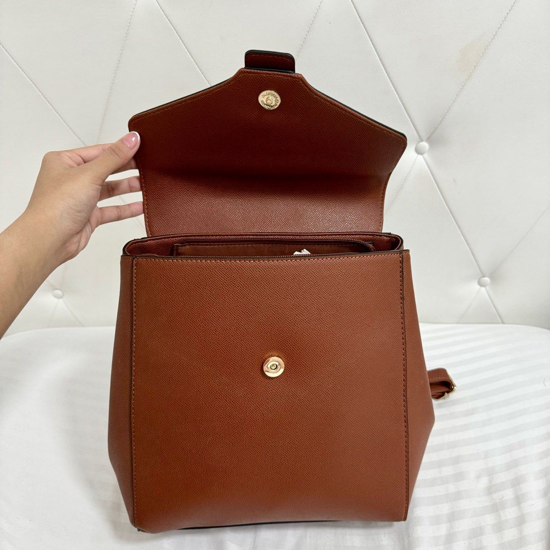 BNEW Bata Brown Backpack (Category: Backpacks) located in Quezon City. Submitted by kcdeclutters (Listing ID 1315844704, Image 3). Description: Brand new with dustbag Super good quality and spacious! Still with tag Adjustable straps No flaws Rfs: Decluttering. I have too many bags already..